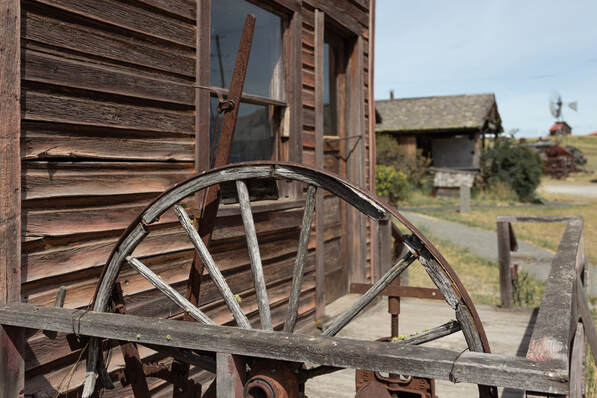 broken wagon wheel in the ghost town of Molson